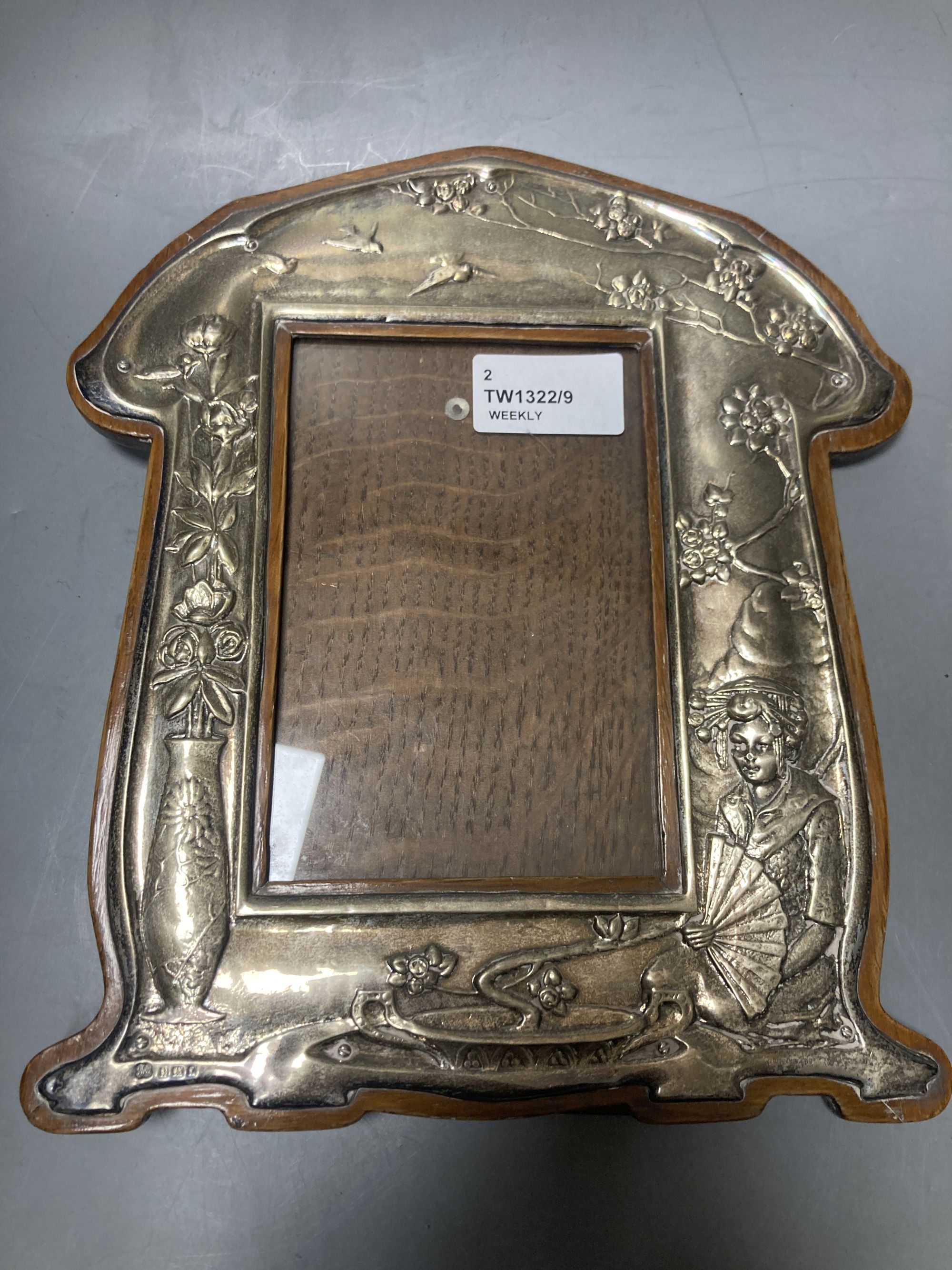 Two Art Nouveau silver-mounted wooden easel photograph frames by Hukin & Heath,